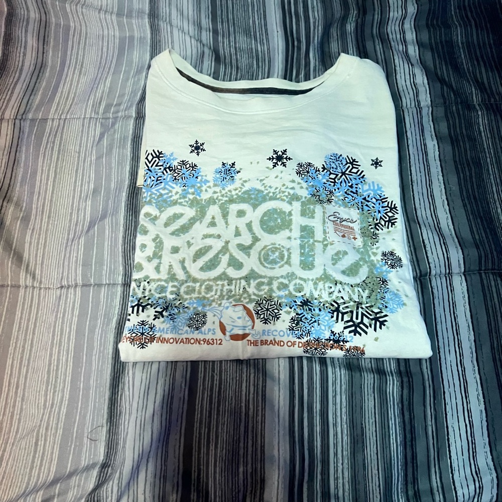 Enyce White Tee with Blue and Black Snowflake Design